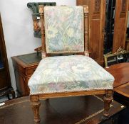 A low level upholstered Victorian walnut nursing c