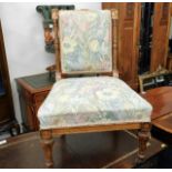 A low level upholstered Victorian walnut nursing c