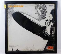 A framed Led Zeppelin album cover