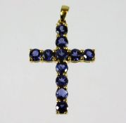A 9ct gold cross pendant set with sapphires 1.7g