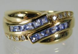 A 14ct gold ring set with tanzanite & diamonds 4.9