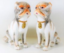 A pair of Meissen style porcelain pugs by Sutherla