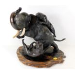 An early 20thC. Chinese bronze elephant & tiger gr
