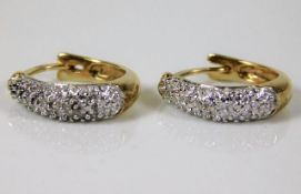A pair of 9ct diamond earrings 2.3g