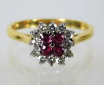 An 18ct gold ring set with diamond & ruby 29g size