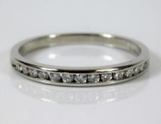 A platinum half eternity ring set with approx. 0.3