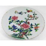 A large Chinese famille rose charger, repair to ch