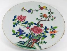 A large Chinese famille rose charger, repair to ch