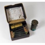 Two brass field microscopes, one boxed & slides