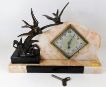 A marble mounted French art deco clock with spelte