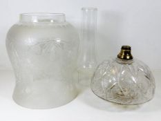 An antique cut glass oil lamp well, an etched oil