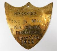 A 1939 brass plaque presented to A. Bell for Quoit