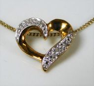 A 9ct gold necklace with heart pendant set with di