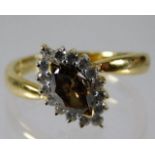 An 18ct gold ring set with fancy colour cinnamon d