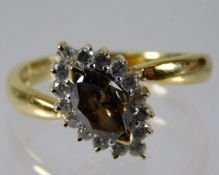 An 18ct gold ring set with fancy colour cinnamon d
