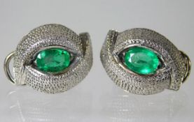 A pair of 18ct white gold clip earrings set with o