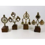 Four mounted antique horse brass ringers, tallest