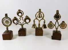 Four mounted antique horse brass ringers, tallest