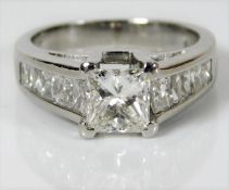 A platinum ring set with 1.07ct centre diamond wit