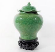 A Chinese porcelain celadon vase & cover decorated