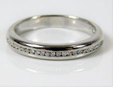 An 18ct white gold half eternity ring set with app