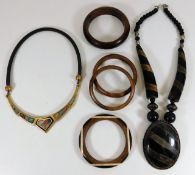 An ethnic necklace with large white metal mounted