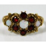 A 9ct gold ring set with garnet & opal 2.1g size L