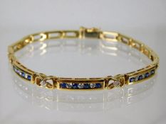 A 9ct gold bracelet set with diamond & sapphire 10