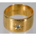 An 18ct gold band set with 0.1ct diamond 7.4g size
