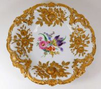 A large 1920's Meissen plate with gilded relief de