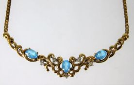 A 9ct gold necklace set with blue topaz 8.3g