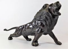 A bronze figure of lion roaring 13.5in long