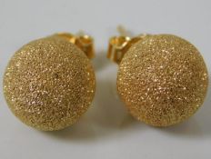 A pair of yellow metal earrings, test as 18ct gold