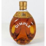 A vintage Dimple whisky bottle & contents
