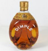 A vintage Dimple whisky bottle & contents