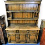 An oak Titchmarsh & Goodwin dresser 73.75in high x