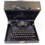 A vintage Corona typewriter with carry case