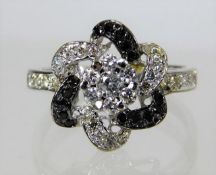 A 14ct white gold ring set with approx. 0.6ct of b