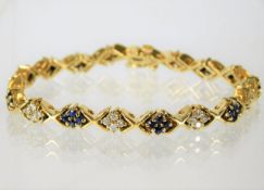 A 14ct gold bracelet set with sapphire & diamond 2