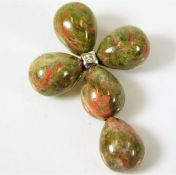 A 9ct gold mounted unakite cross set with a small