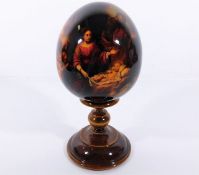 A wooden Russian egg & stand 7.75in tall