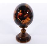 A wooden Russian egg & stand 7.75in tall