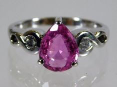 An 18ct white gold pink sapphire ring set with dia