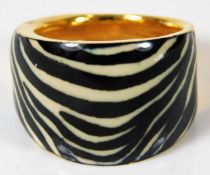 A 21ct Italian enamelled ring with zebra effect 5.