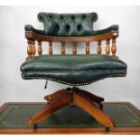 A leather upholstered captains chair 32.5in high t