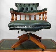 A leather upholstered captains chair 32.5in high t