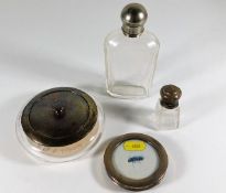 A silver topped powder jar, a small silver photo f