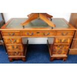 A mahogany pedestal desk with seven drawers 47.5in