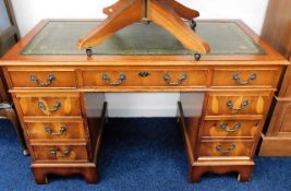 A mahogany pedestal desk with seven drawers 47.5in