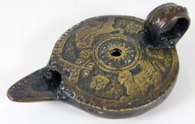 A bronze Roman style oil lamp 4.25in long